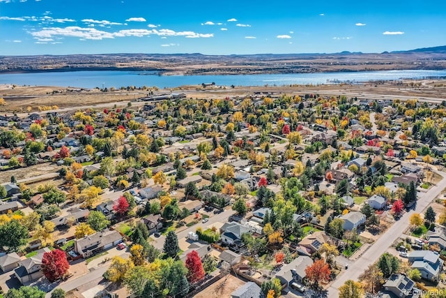 drone / aerial view featuring a water and mountain view