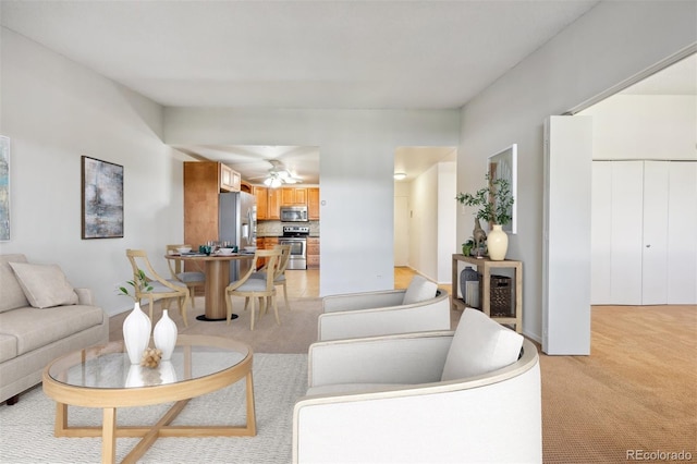 725 S Alton Way Unit 7D, Denver, CO 80247 - living area featuring ceiling fan and light carpet