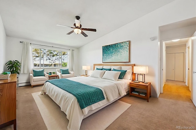 725 S Alton Way Unit 7D, Denver, CO 80247 - bedroom featuring a baseboard heating unit, light colored carpet, vaulted ceiling, and ceiling fan