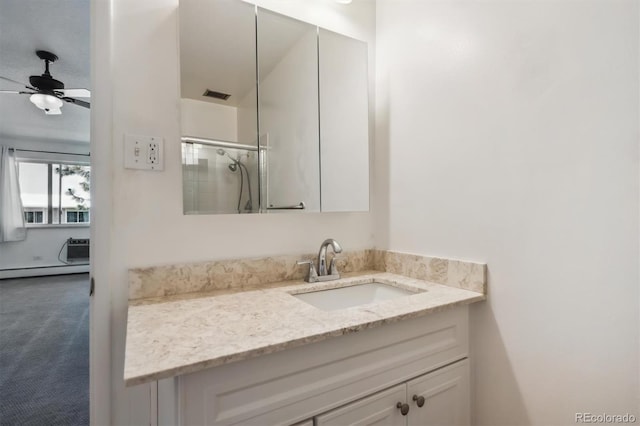 725 S Alton Way Unit 7D, Denver, CO 80247 - bathroom with vanity, a baseboard heating unit, a shower, ceiling fan, and a wall unit AC