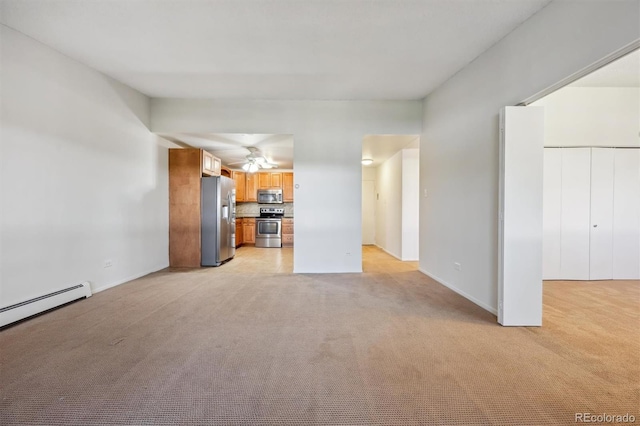 725 S Alton Way Unit 7D, Denver, CO 80247 - unfurnished living room with light carpet, a ceiling fan, and a baseboard heating unit
