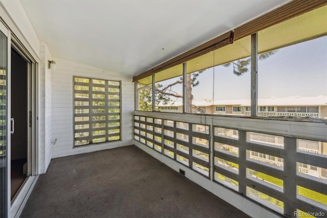 725 S Alton Way Unit 7D, Denver, CO 80247 - unfurnished sunroom with lofted ceiling