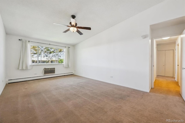 725 S Alton Way Unit 7D, Denver, CO 80247 - carpeted empty room with a ceiling fan, vaulted ceiling, a baseboard heating unit, and a wall unit AC