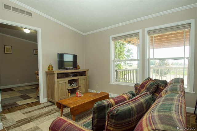 living room with lofted ceiling, light hardwood / wood-style flooring, and ornamental molding