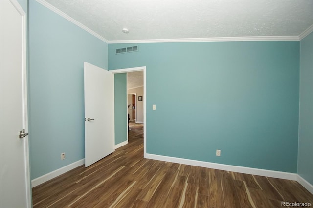 unfurnished bedroom featuring crown molding, dark wood-type flooring, and a textured ceiling