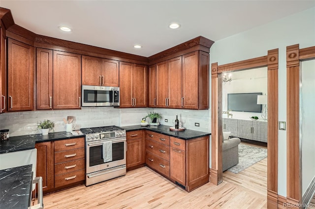 209 S Lincoln St, Denver, CO 80209 - kitchen with stainless steel appliances, light wood-style flooring, decorative backsplash, brown cabinetry, and recessed lighting