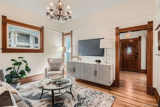 209 S Lincoln St, Denver, CO 80209 - living room with light wood-type flooring and a chandelier