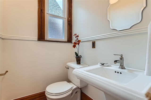 209 S Lincoln St, Denver, CO 80209 - half bathroom with toilet and a sink