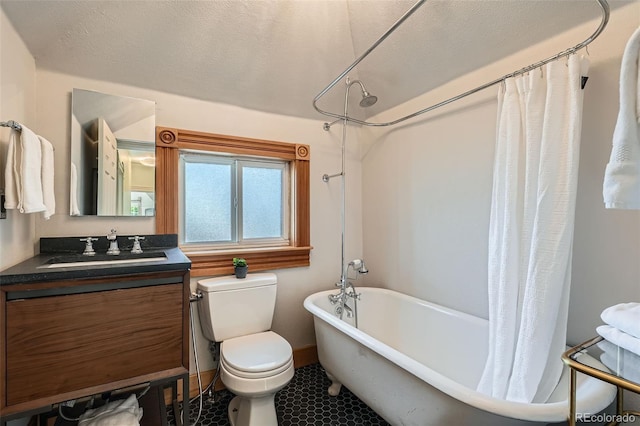 209 S Lincoln St, Denver, CO 80209 - bathroom featuring vanity, toilet, a combined bath / shower with freestanding tub, and tile patterned floors