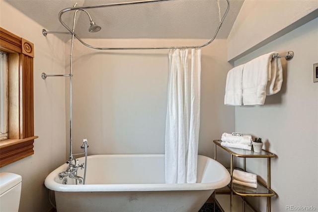 209 S Lincoln St, Denver, CO 80209 - bathroom with toilet and a combined bath / shower with freestanding tub