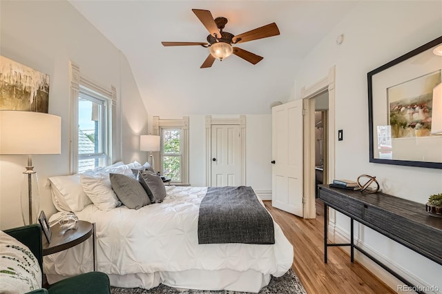 209 S Lincoln St, Denver, CO 80209 - bedroom with light wood finished floors, lofted ceiling, and ceiling fan