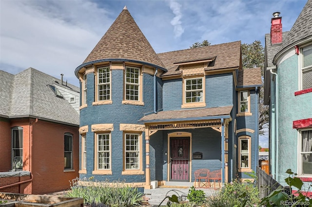 209 S Lincoln St, Denver, CO 80209 - victorian home featuring a porch and a shingled roof