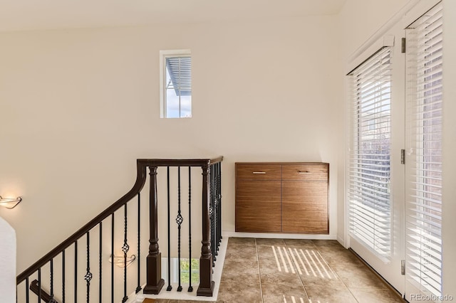 3491 Cascina Pl Unit D, Highlands Ranch, CO 80126 - stairway with healthy amount of natural light and tile patterned flooring