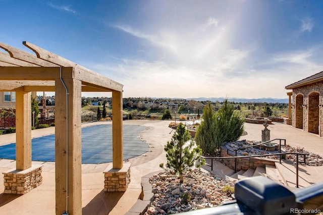 3491 Cascina Pl Unit D, Highlands Ranch, CO 80126 - view of swimming pool featuring a patio and a mountain view