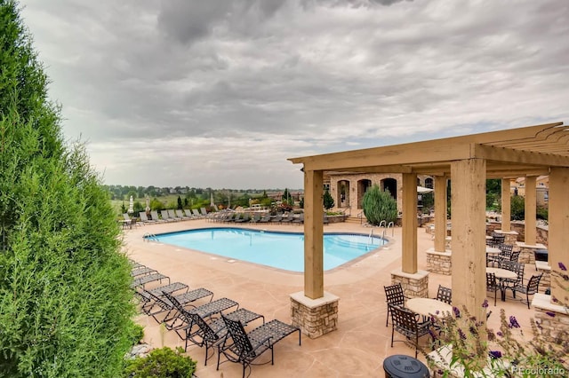 3491 Cascina Pl Unit D, Highlands Ranch, CO 80126 - community pool featuring a patio area and a pergola