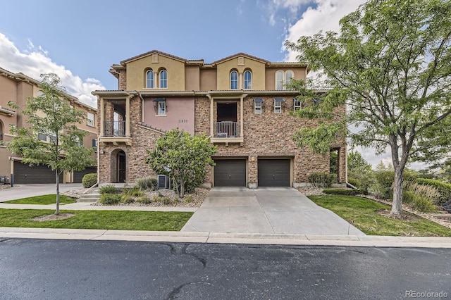 3491 Cascina Pl Unit D, Highlands Ranch, CO 80126 - mediterranean / spanish home with a balcony, stucco siding, driveway, and a garage