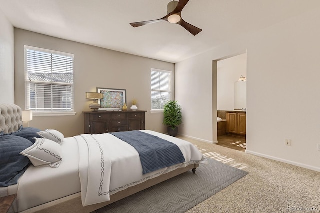 3491 Cascina Pl Unit D, Highlands Ranch, CO 80126 - bedroom featuring light colored carpet, ensuite bath, and ceiling fan