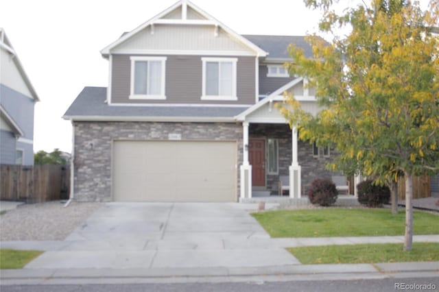 view of front of house featuring a front yard and a garage