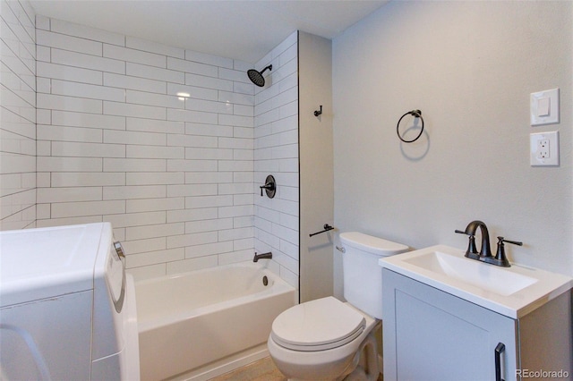 full bathroom featuring toilet, vanity, shower / tub combination, and washer / dryer