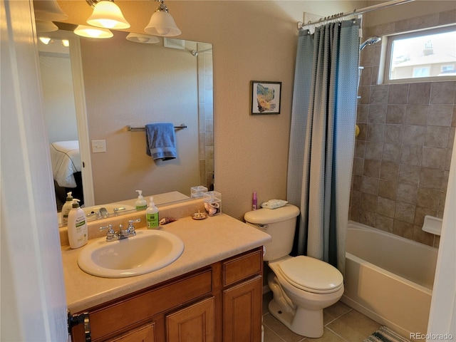 full bathroom featuring shower / bath combo with shower curtain, tile patterned flooring, vanity, and toilet