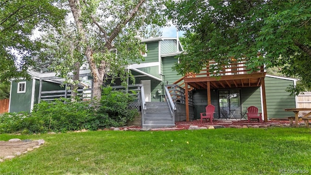 10718 Ash Ct, Thornton, CO 80233 - back of house with stairs, a deck, and a yard