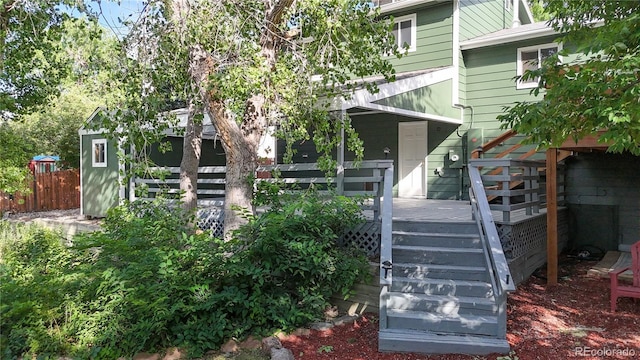 10718 Ash Ct, Thornton, CO 80233 - doorway to property featuring a wooden deck