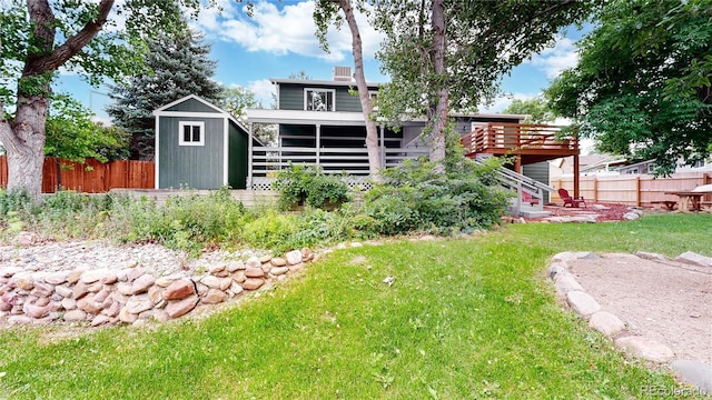 10718 Ash Ct, Thornton, CO 80233 - rear view of property with a shed, stairs, and a wooden deck