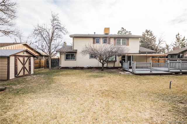 1409 S Moline St, Aurora, CO 80012 - rear view of property featuring a storage unit, a wooden deck, and a chimney