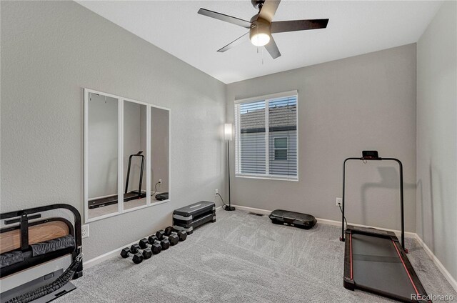 workout room with carpet flooring and ceiling fan