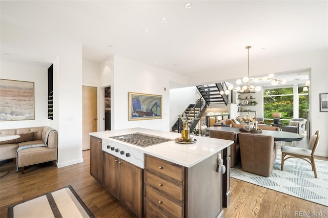 3220 Zuni St, Denver, CO 80211 - kitchen featuring open floor plan, wood finished floors, and a chandelier