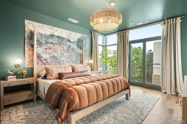 3220 Zuni St, Denver, CO 80211 - bedroom featuring access to outside and wood finished floors