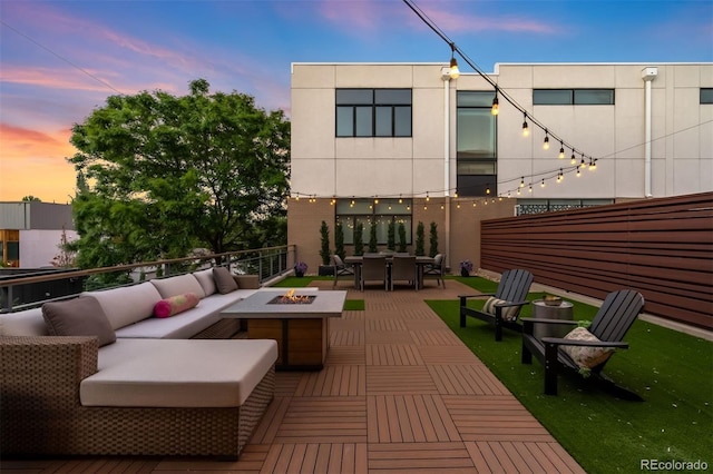 3220 Zuni St, Denver, CO 80211 - rear view of house with an outdoor living space with a fire pit, outdoor dining space, and a wooden deck