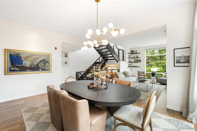 3220 Zuni St, Denver, CO 80211 - dining area featuring stairs, wood finished floors, and a chandelier
