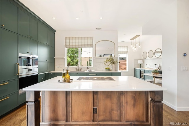 3220 Zuni St, Denver, CO 80211 - kitchen with green cabinets, electric cooktop, wine cooler, and plenty of natural light