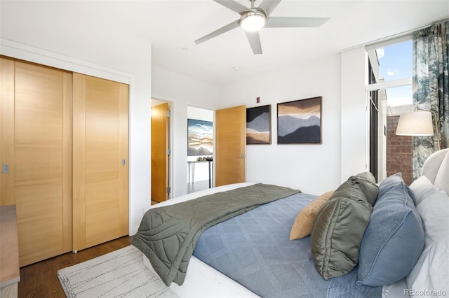 3220 Zuni St, Denver, CO 80211 - bedroom featuring multiple windows, wood finished floors, ceiling fan, and a closet