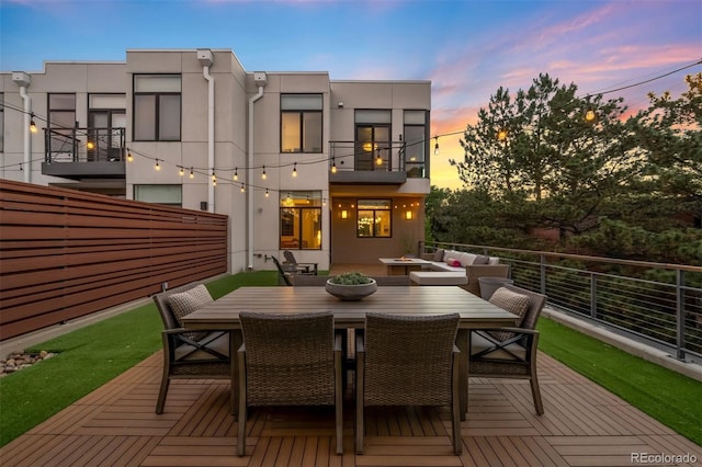 3220 Zuni St, Denver, CO 80211 - rear view of house with stucco siding, outdoor dining area, a balcony, and a wooden deck
