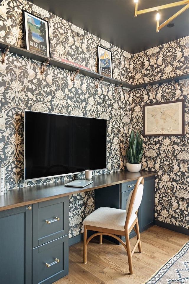 3220 Zuni St, Denver, CO 80211 - office space with wallpapered walls, light wood-type flooring, and built in study area