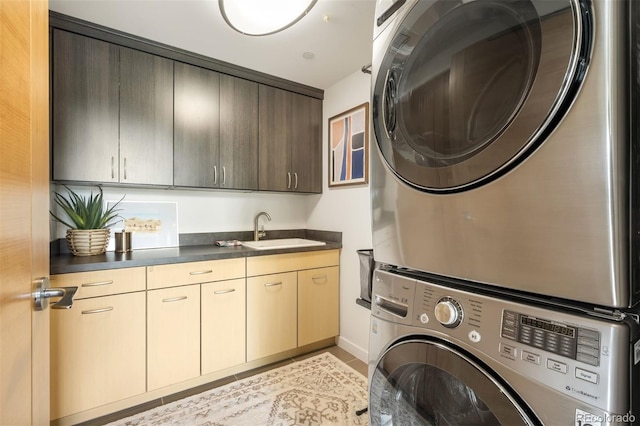 3220 Zuni St, Denver, CO 80211 - laundry room with stacked washer / drying machine and cabinet space