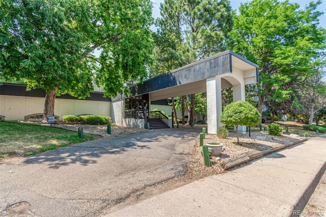 view of front of home with a carport