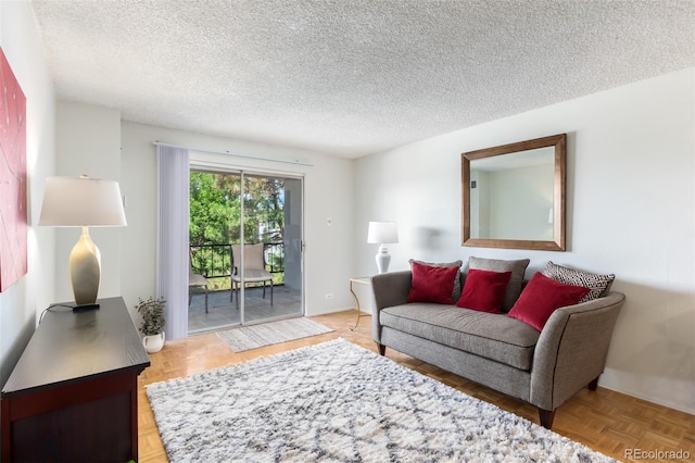 living room with parquet floors and a textured ceiling