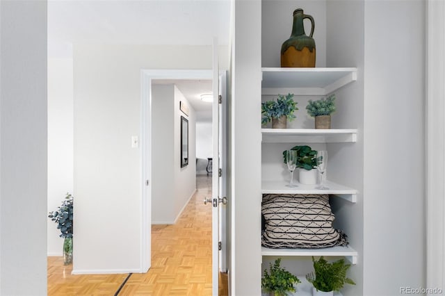 corridor with light parquet flooring