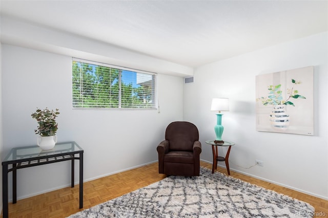 sitting room featuring light parquet floors