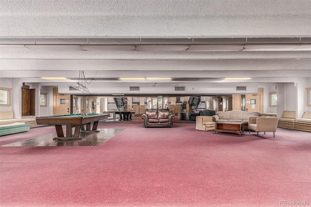 living room with carpet, billiards, and a textured ceiling