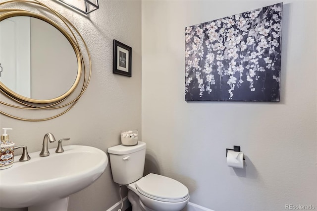 bathroom with sink and toilet