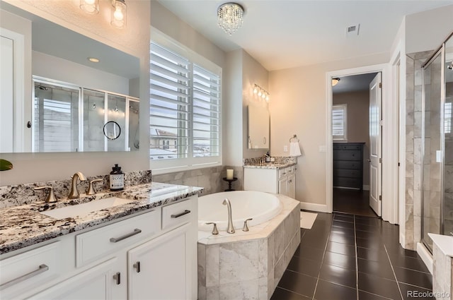 bathroom with vanity, separate shower and tub, and tile patterned flooring