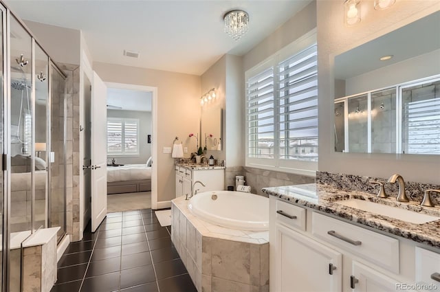 bathroom with vanity, independent shower and bath, and tile patterned floors