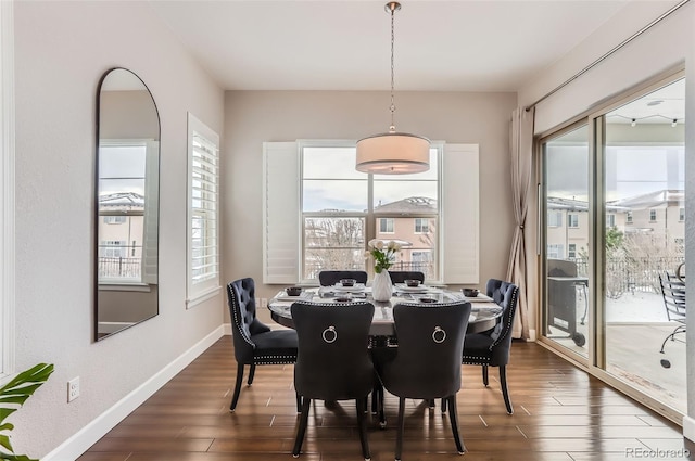 dining room with dark wood-style floors and baseboards