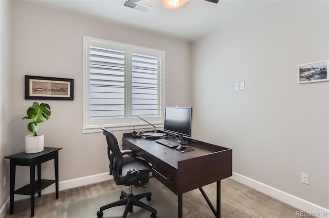 office space with light colored carpet, visible vents, and baseboards