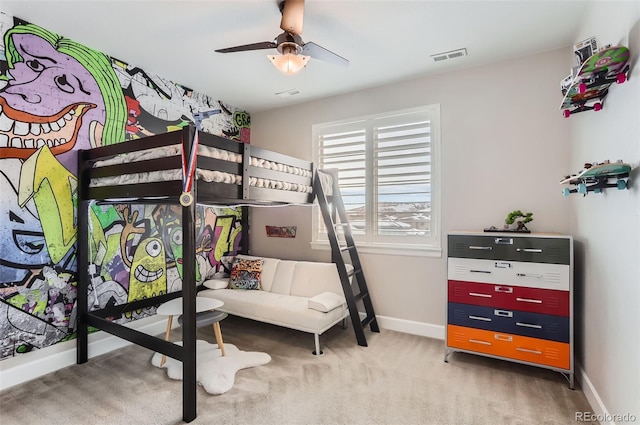 carpeted bedroom with a ceiling fan, visible vents, and baseboards