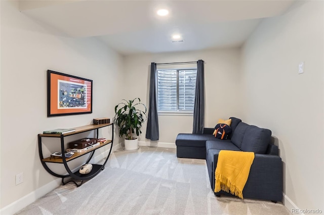 living area with carpet floors, baseboards, and recessed lighting